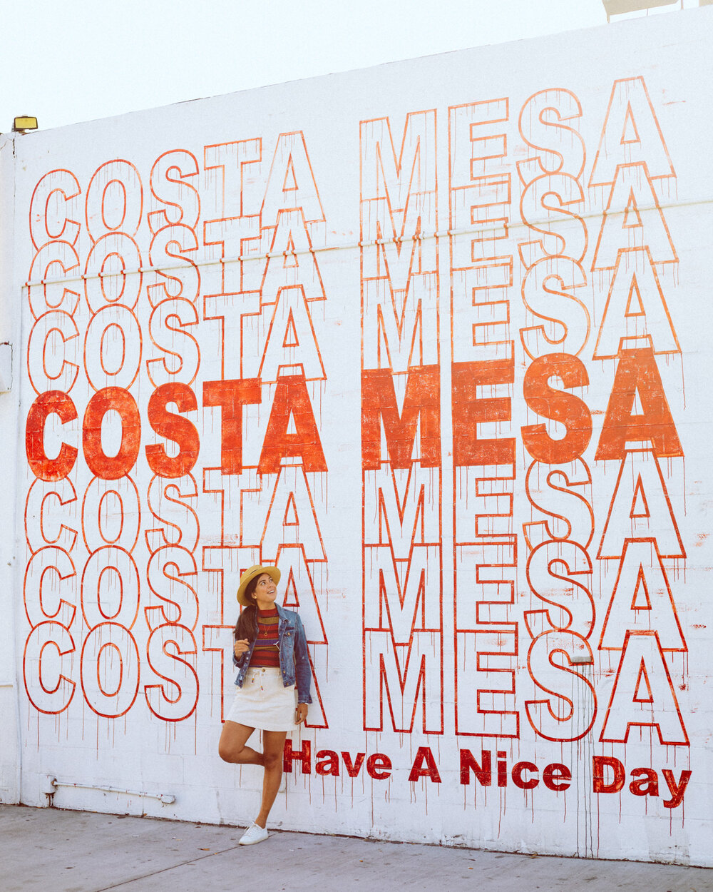 Rachel Off Duty: A Woman Standing and Leaning against the Costa Mesa Have a Nice Day Mural