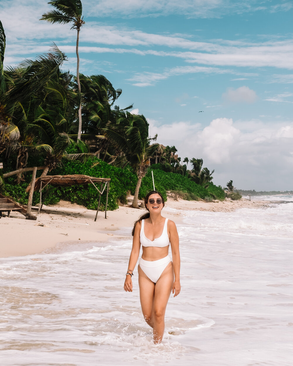 Rachel Off Duty: A Woman in a White Swimsuit at Papaya Playa, Tulum