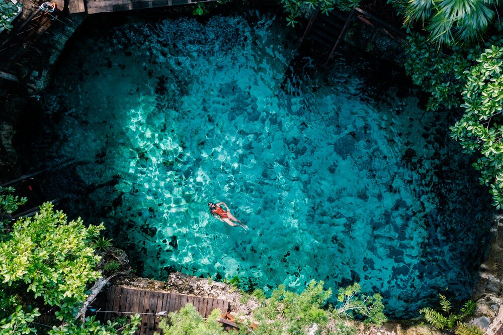 Rachel Off Duty: A Woman Floating in a Cenote in Tulum, Mexico