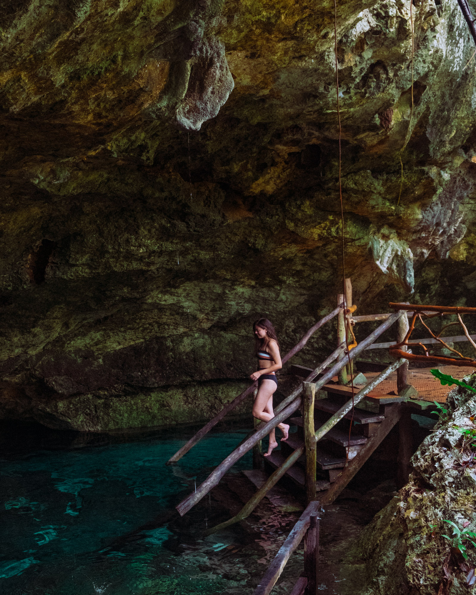Rachel Off Duty: A Woman Climbing Down to Cenote Dos Ojos, Tulum, Mexico