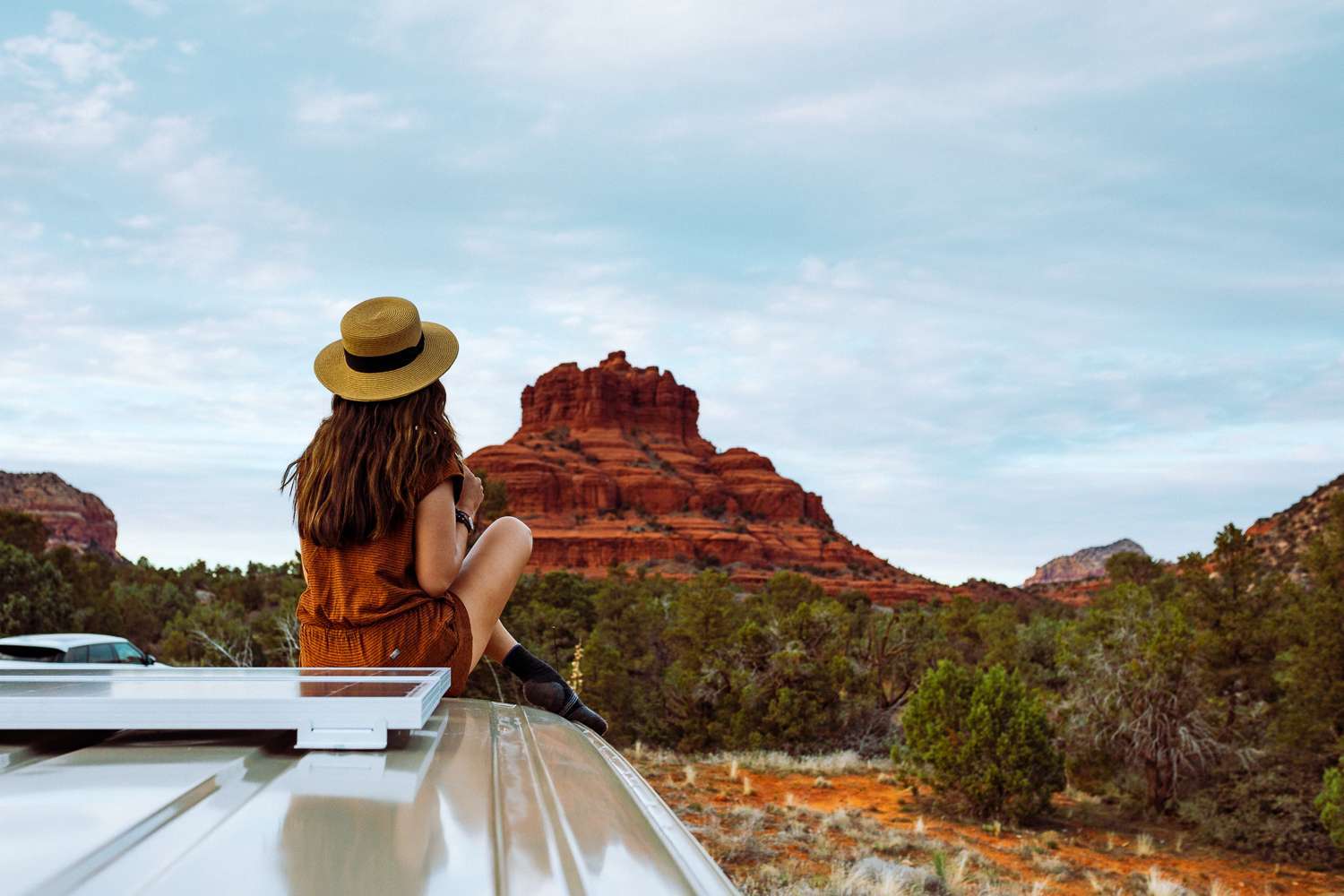 Rachel Off Duty: A Woman Sits on a Campervan in Sedona, USA