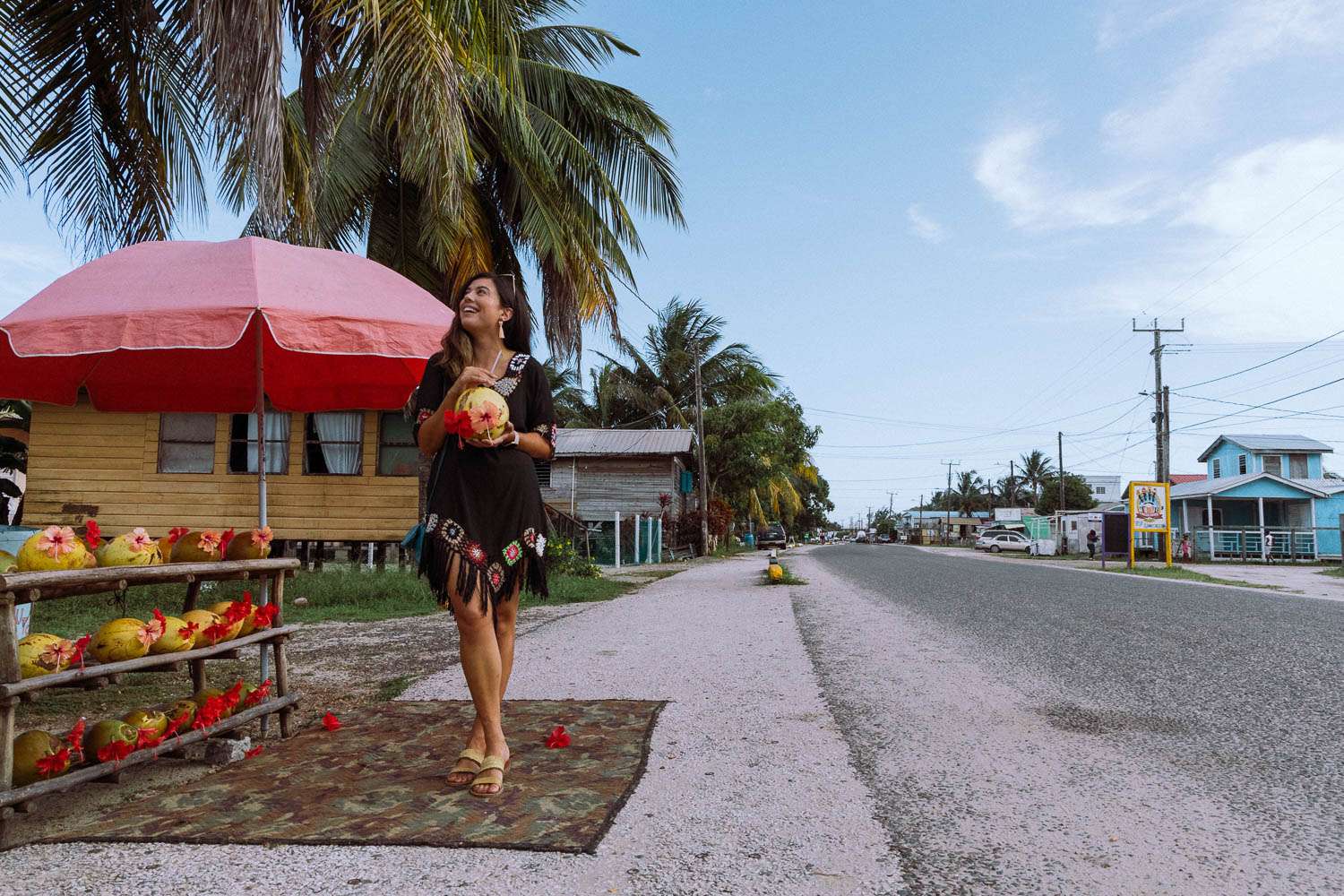 Rachel Off Duty: A Woman Smiling with a Coconut in Placencia, Belize