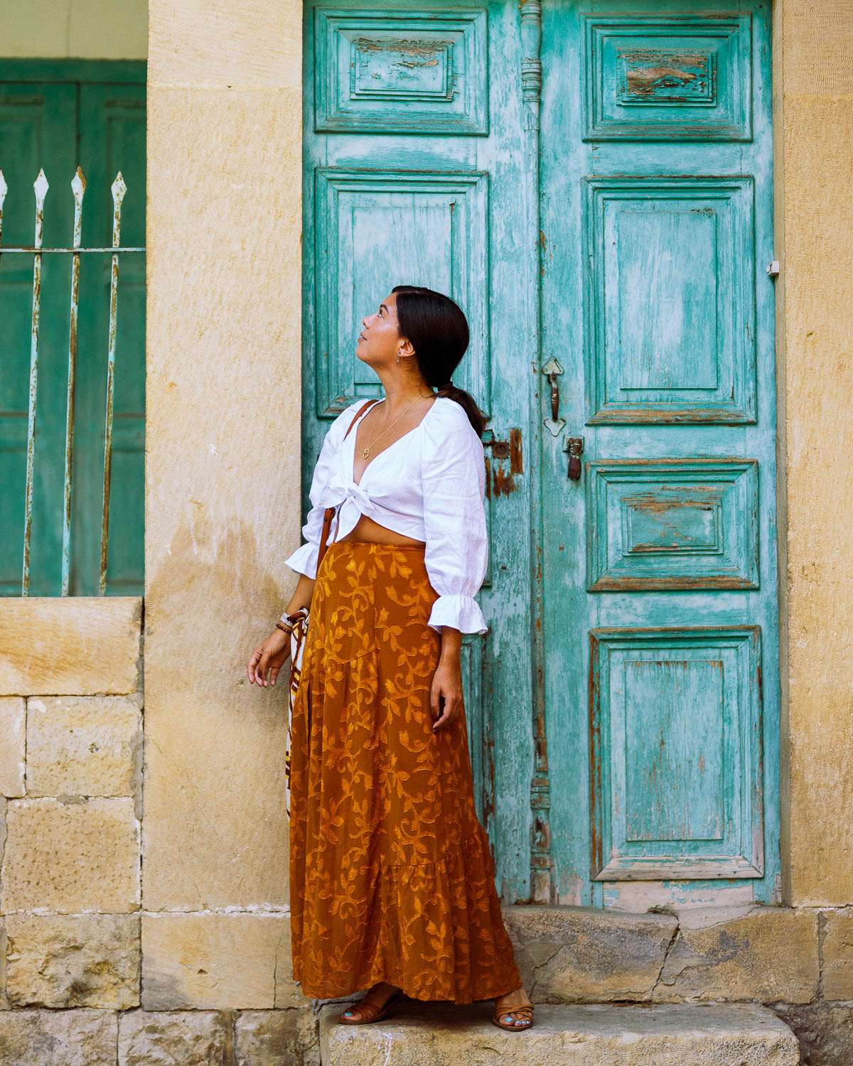 Rachel Off Duty: A Woman Stands in Front of a Blue Door in The Chouf, Lebanon