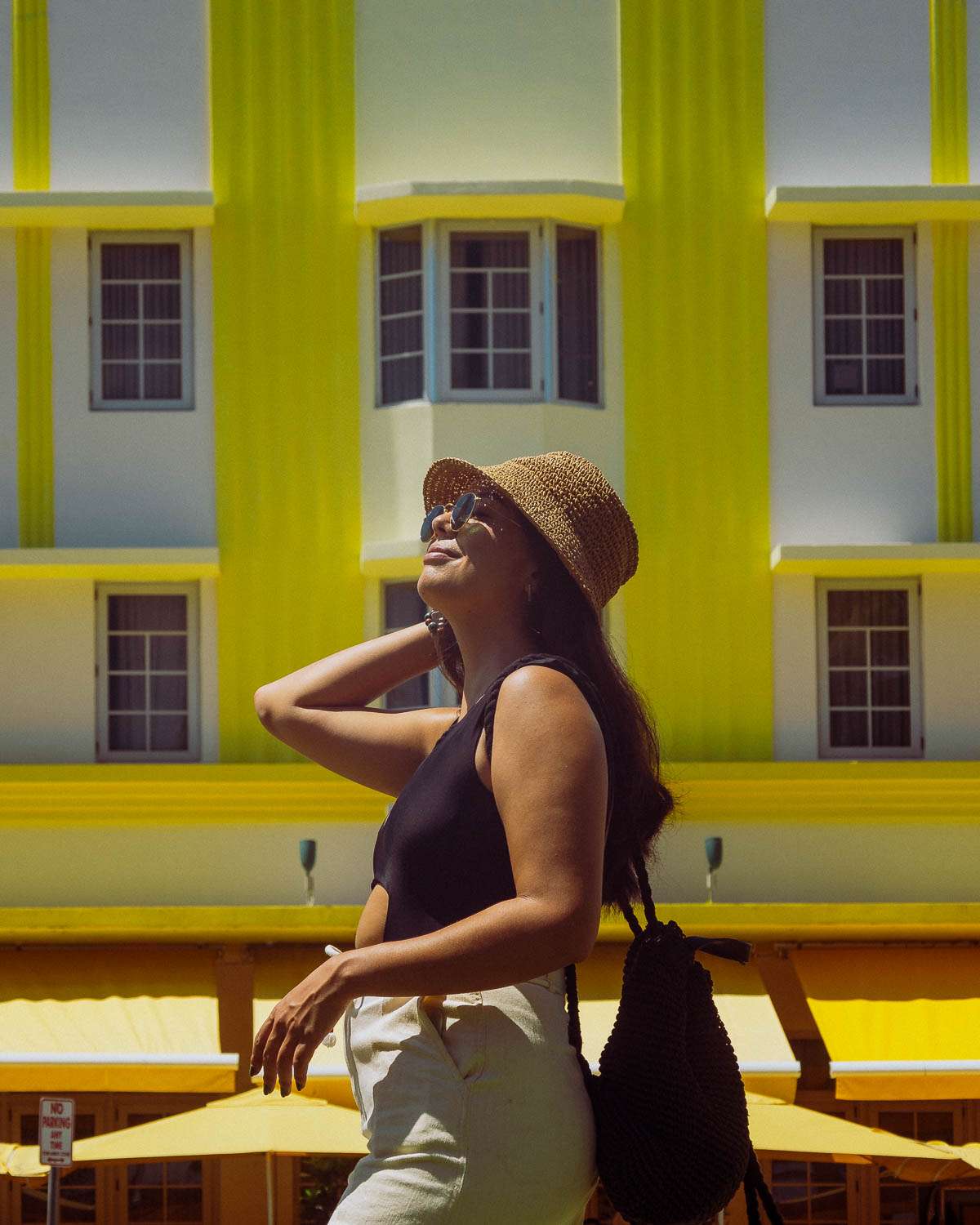 Rachel Off Duty: Woman Posing in Front of Yellow Art Deco Building